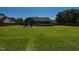 Large backyard featuring an above ground pool, deck, and fenced perimeter at 90 Pump Station Rd, Erwin, NC 28339