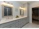 Bright bathroom featuring double sinks, modern fixtures, a shower and elegant tile at 90 Pump Station Rd, Erwin, NC 28339
