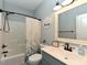 Full bathroom with a tub/shower combination, vanity, and decorative mirror at 90 Pump Station Rd, Erwin, NC 28339