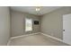 Simple bedroom with neutral paint, carpet, a window, and a ceiling fan at 90 Pump Station Rd, Erwin, NC 28339