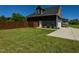 Charming home exterior featuring lush green grass, a white door, and a black exterior with white trim at 90 Pump Station Rd, Erwin, NC 28339
