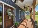Charming front porch with a decorated door and comfortable rocking chairs at 90 Pump Station Rd, Erwin, NC 28339