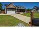 Spacious driveway leading to a charming home with a well-kept lawn and mailbox at 90 Pump Station Rd, Erwin, NC 28339