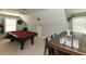 This game room features a pool table, dart board, deer head and bar with four stools for entertainment at 90 Pump Station Rd, Erwin, NC 28339
