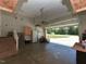 This spacious garage has high ceilings, a lawn mower, and stairs leading to the home's interior at 90 Pump Station Rd, Erwin, NC 28339