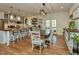 An open concept kitchen featuring hardwood floors, modern appliances, and stylish barstool seating at 90 Pump Station Rd, Erwin, NC 28339