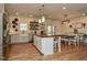 Bright kitchen with white cabinetry, farmhouse sink, and a center island at 90 Pump Station Rd, Erwin, NC 28339