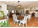 Open concept kitchen and dining area featuring modern lighting fixtures and hardwood floors at 90 Pump Station Rd, Erwin, NC 28339