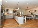 A well-lit kitchen featuring stainless steel appliances, an island with seating, and shiplap walls at 90 Pump Station Rd, Erwin, NC 28339