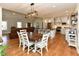 Spacious open concept with stainless steel appliances and dining area, flowing into the living room at 90 Pump Station Rd, Erwin, NC 28339