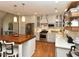 Bright eat-in kitchen featuring stainless steel appliances, hardwood floors and plenty of cabinet space at 90 Pump Station Rd, Erwin, NC 28339