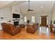 Inviting living room featuring a cozy fireplace, hardwood floors, and a stylish entryway at 90 Pump Station Rd, Erwin, NC 28339