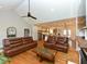 Bright living room featuring hardwood floors, vaulted ceiling, and modern furnishings at 90 Pump Station Rd, Erwin, NC 28339