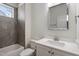 Cozy bathroom with tub, toilet, vanity and sink with a mirror at 905 Moye Dr, Raleigh, NC 27606
