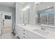 Bright bathroom with double sinks, framed mirrors, and a spacious shower at 905 Moye Dr, Raleigh, NC 27606