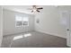 Bedroom featuring a ceiling fan, natural lighting from several windows, and neutral carpeting at 905 Moye Dr, Raleigh, NC 27606