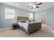 Light and airy bedroom featuring a ceiling fan and ensuite bathroom at 905 Moye Dr, Raleigh, NC 27606