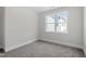 Neutral bedroom with a window overlooking other homes at 905 Moye Dr, Raleigh, NC 27606