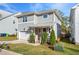 A charming two-story home, lush lawn, an attached garage, inviting front porch at 905 Moye Dr, Raleigh, NC 27606