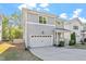 This two-story home boasts a garage, well-maintained lawn, and classic siding at 905 Moye Dr, Raleigh, NC 27606