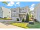 Beautiful two-story house featuring a covered front porch, garage, and green lawn at 905 Moye Dr, Raleigh, NC 27606