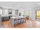 Spacious kitchen with stainless steel appliances, a large island, and a breakfast nook with natural lighting at 905 Moye Dr, Raleigh, NC 27606