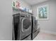 Well-organized laundry room featuring front-load washer and dryer at 905 Moye Dr, Raleigh, NC 27606