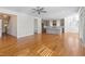 Open living space with hardwood floors, a kitchen view, and seamless transitions between rooms at 905 Moye Dr, Raleigh, NC 27606