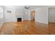 Spacious living room with hardwood floors, a fireplace, and abundant natural light from multiple windows at 905 Moye Dr, Raleigh, NC 27606