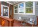 Cozy patio with outdoor seating and a view through a screened-in porch door at 905 Moye Dr, Raleigh, NC 27606
