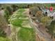 Beautiful aerial view of this property showcasing a private community and golf course at 9220 Meadow Mist Ct, Raleigh, NC 27617