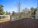 Relax on the back deck with views of the lush greenery and mature trees surrounding the property at 9220 Meadow Mist Ct, Raleigh, NC 27617