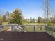 Enjoy outdoor living on this wooden deck overlooking a manicured lawn and picturesque surroundings at 9220 Meadow Mist Ct, Raleigh, NC 27617