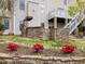 Landscaped backyard featuring an outdoor kitchen, stone accents, and a beautiful upper deck area at 9220 Meadow Mist Ct, Raleigh, NC 27617