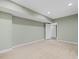 Bright basement with neutral paint and clean carpet leading to another room at 9220 Meadow Mist Ct, Raleigh, NC 27617