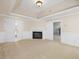 Finished basement featuring a cozy fireplace and neutral carpeting at 9220 Meadow Mist Ct, Raleigh, NC 27617