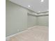Bright basement with neutral paint, clean carpet, and plenty of natural light at 9220 Meadow Mist Ct, Raleigh, NC 27617