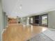 Open basement design, featuring a stone fireplace and access to a bar/kitchen area at 9220 Meadow Mist Ct, Raleigh, NC 27617