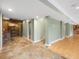 Spacious basement area with stone accents, wooden trim and room for customization at 9220 Meadow Mist Ct, Raleigh, NC 27617