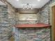 Basement features a stone bar and art enhancing the rustic charm of the space at 9220 Meadow Mist Ct, Raleigh, NC 27617