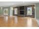 Basement featuring a stone fireplace and abundant natural light from surrounding windows at 9220 Meadow Mist Ct, Raleigh, NC 27617