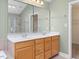 Bathroom with double vanity sinks, large mirror, and a walk-in shower at 9220 Meadow Mist Ct, Raleigh, NC 27617