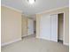 Bright bedroom with carpet, doors, and base molding throughout the space at 9220 Meadow Mist Ct, Raleigh, NC 27617