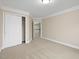 Bright bedroom with carpet, doors, and base molding throughout the space at 9220 Meadow Mist Ct, Raleigh, NC 27617
