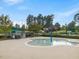 Fun splash pad and pool area for , surrounded by lush greenery in a Gathering-friendly community at 9220 Meadow Mist Ct, Raleigh, NC 27617