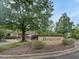 Brier Creek Swim & Tennis Pavilion sign amid lush landscaping creates a welcoming entrance to this community at 9220 Meadow Mist Ct, Raleigh, NC 27617
