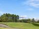 Community driving range with manicured grass and nets at 9220 Meadow Mist Ct, Raleigh, NC 27617