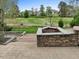 An angular stone-surround fire pit with great landscaping and views at 9220 Meadow Mist Ct, Raleigh, NC 27617