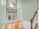 Grand foyer featuring soaring ceilings, elegant light fixtures, and hardwood floors, creating a welcoming atmosphere at 9220 Meadow Mist Ct, Raleigh, NC 27617