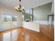 Open concept living space featuring a fireplace, abundant windows, and access to the backyard at 9220 Meadow Mist Ct, Raleigh, NC 27617